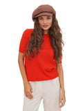 Three-quarter view of woman wearing cocoa brown cotton paperboy hat