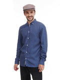Side angle man wearing cocoa flat cap with blue denim shirt casual smile