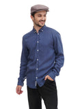 Man in cocoa flat cap torso view front angle with blue denim shirt