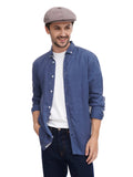 Full body shot man wearing cocoa cotton flat cap with denim shirt and dark jeans