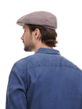 Man wearing cocoa 8-panel flat cap relaxed stance hands in pockets front view