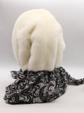Back view cream mink fur hat hood cowl on mannequin showing full ivory mink coverage and black knit cowl