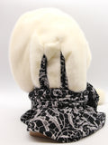 Back view cream mink fur hat hood showing full ivory mink coverage and black patterned fabric ties hanging