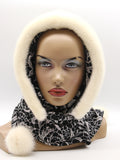 Cream mink fur hat hood front view on mannequin showing warm ivory mink and black patterned fabric ties