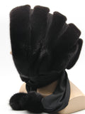 Side profile dark brown mink black suede striped fur hat hood on mannequin showing stripe depth and black fabric ties