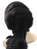 Close view dark brown mink black suede striped fur hat hood showing rich warm brown mink pile against flat black suede