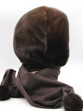 Detail view brown fabric scarf end of dark chocolate mink fur hat hood showing matching mink pompon