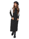 Full body view woman in dark grey cashmere baker boy cap with black midi dress