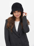 Woman in dark grey cloche hat, three-quarter view, blazer