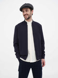 Side profile dark grey herringbone newsboy cap showing 8-panel crown