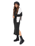 Side view woman in dark grey cashmere paperboy hat with black outfit full body