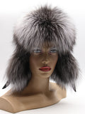 Fox fur hat with leather crown worn straight on, fox ear flaps covering the cheeks
