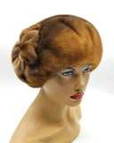 Golden brown mink beret with mink fur flower three-quarter left view showing rare amber fur tone and flower position