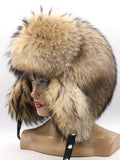 Right profile of golden raccoon fur ushanka showing rounded crown and long ear flap