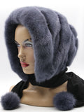 Graphite mink and black suede striped fur hat hood with pompons on mannequin, front view showing dark contrast stripe construction