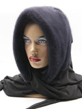 Three-quarter view graphite mink fur hat hood showing charcoal mink surface and dark shawl drape