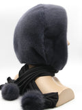 Front angled view graphite mink hood on mannequin showing charcoal tone against light background