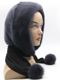 Graphite mink fur hood front view on mannequin showing deep charcoal dyed mink surface and clean face opening