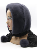 Graphite grey dyed mink fur hood scarf on mannequin front three-quarter view showing deep charcoal mink and dark fabric scarf