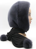 Detail view graphite mink fur hood scarf showing dark fabric scarf end with mink pompon in matching graphite tone