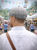 Gray check linen newsboy hat men three quarter view festival setting