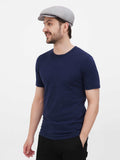 Man in gray linen newsboy cap full body casual outfit