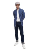 Grey baker boy hat styled with denim shirt casual stance hands in pockets front view