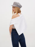Close-up crop of woman in grey linen newsboy cap touching shoulder, white top