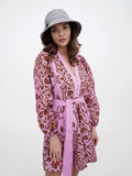 Woman in grey sun hat and pink dress, front-facing pose