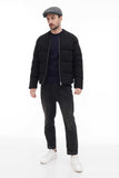 Man wearing grey tweed flat cap standing casual pose black bomber jacket front view