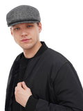 Man wearing grey tweed flat cap front view black jacket autumn