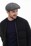 Front view man wearing grey tweed baker boy hat casual smile with black jacket