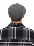 Grey wool newsboy cap back three quarter view 8-panel construction