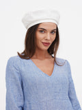 Handcrafted white linen beret women, side glance portrait showing beret tilt and profile