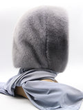 Three-quarter back view iris grey mink fur hood scarf showing mink crown and pale fabric scarf drape