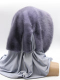 Detail view blue-grey jersey shawl fabric of iris mink fur hat hood showing soft knit texture without pompons