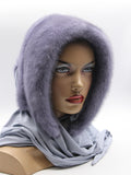 Three-quarter view iris purple mink fur hat hood showing violet-grey mink surface and blue-grey jersey shawl drape