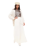 Woman in ivory cotton Breton sailor cap and white outfit, full length