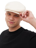 Man adjusting ivory cotton flat cap close-up front view summer hat