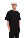 Man in ivory cotton flat cap side back view casual summer style