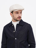 Side profile ivory cream linen newsboy cap soft straight visor detail