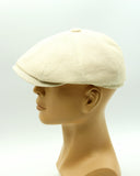 Ivory linen canvas newsboy cap mannequin side view 8-panel crown