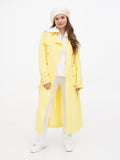 Ivory wool beret with flower on woman in yellow trench coat, full length front view spring outfit