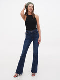 Khaki linen beret for women full length front view with black sleeveless top and dark flared jeans