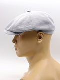 Light blue linen baker boy cap mannequin side view brim detail