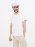 Man wearing light blue linen cap full body casual summer outfit