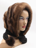 Three-quarter back view light brown mink brown suede striped fur hat cowl showing warm stripe and cowl neck coverage