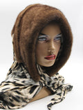 Light brown mink fur hat hood front view on mannequin showing natural warm mink and classic brown leopard scarf