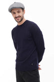 Man in light grey tweed 8-panel newsboy cap torso front view showing cap fit