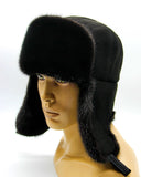 Angled view man wearing black mink bomber ushanka earflaps down